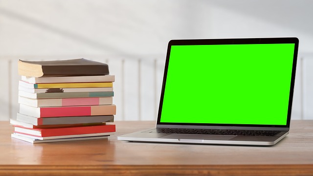 technology learning guides on laptop with smart device accessories and tidy desk